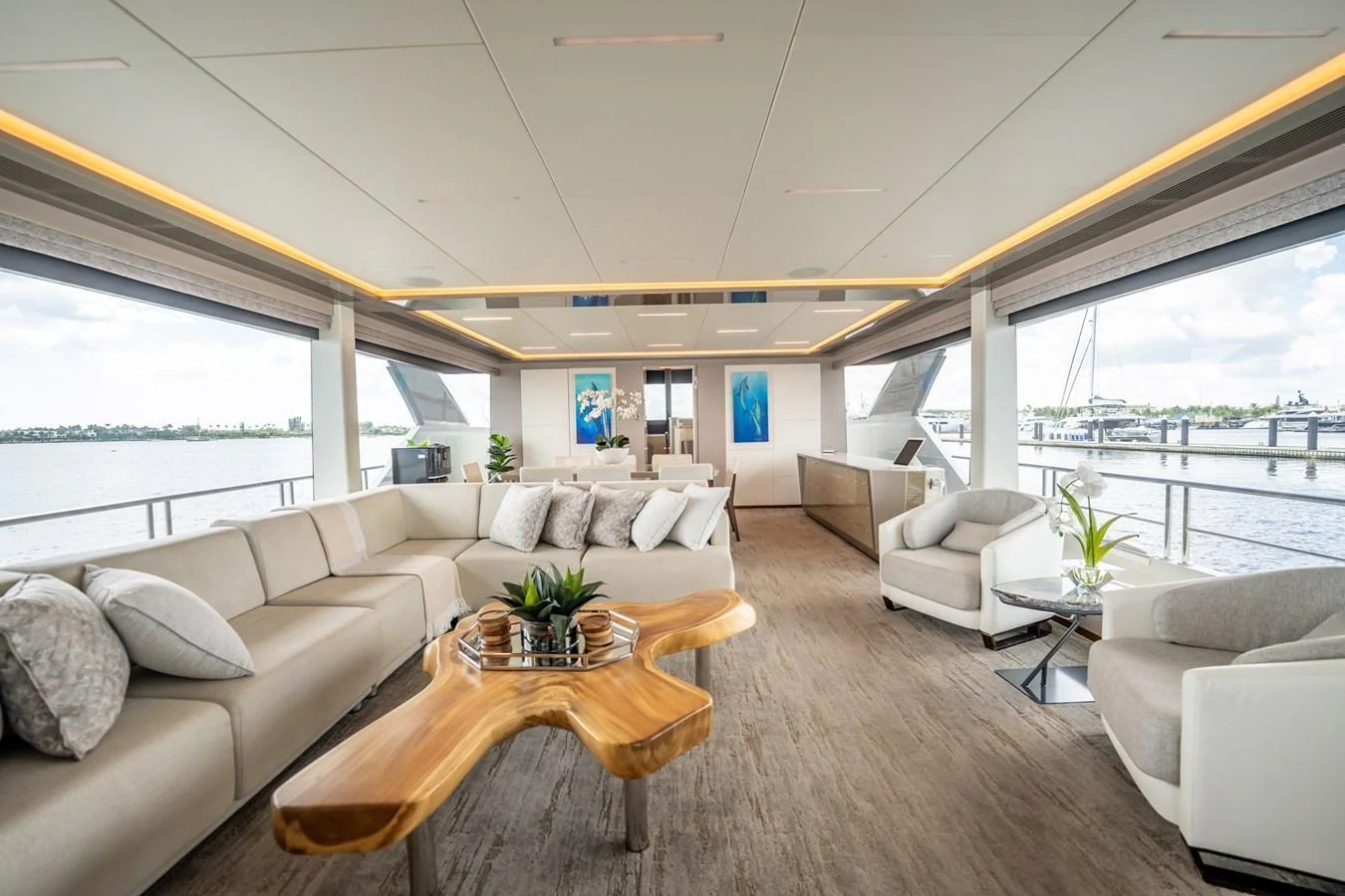 The spacious salon features elegant seating and panoramic views, creating a luxurious and inviting atmosphere. aboard AQUASITION Yacht for Sale