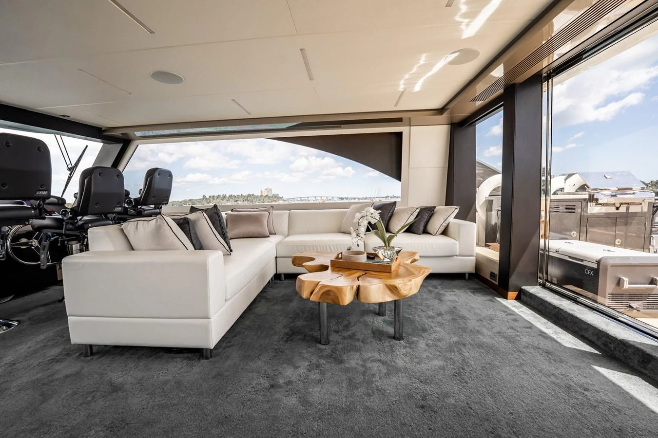 The salon features a spacious seating area with modern furnishings and large windows offering stunning views. aboard AQUASITION Yacht for Sale