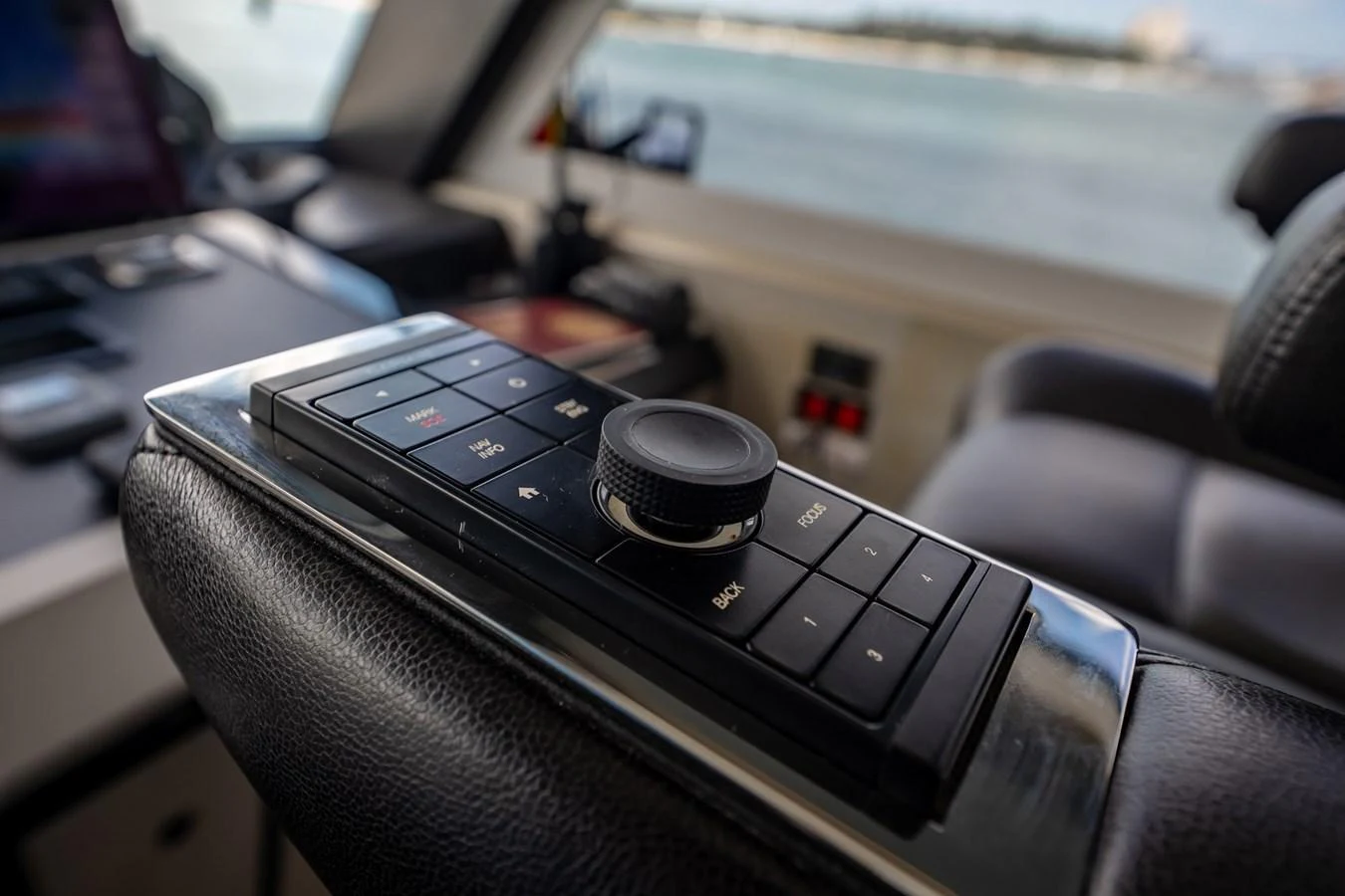 A close-up of a modern control panel on the yacht's helm. aboard AQUASITION Yacht for Sale