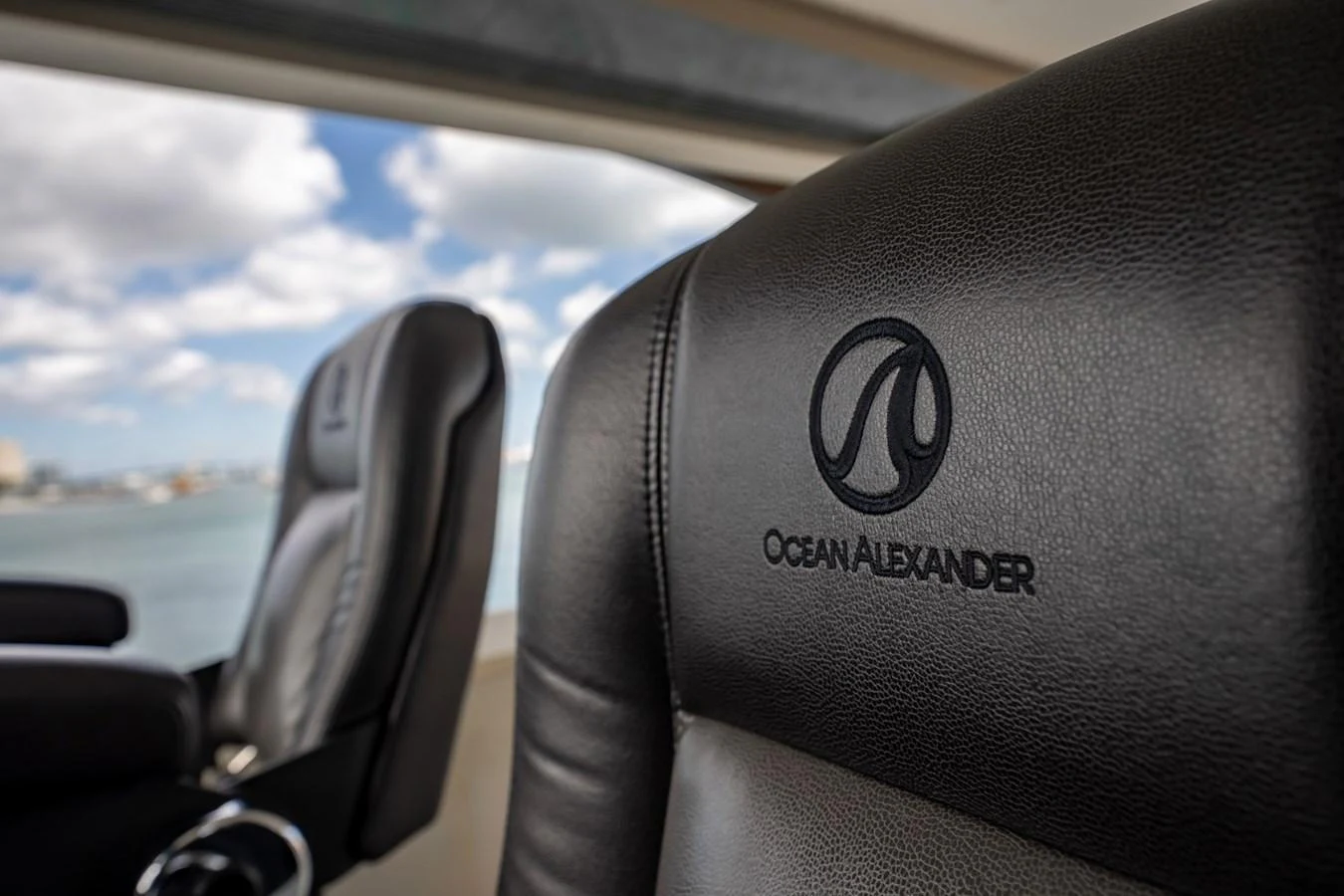 Luxurious leather seating with branded embroidery offers comfort and style. aboard AQUASITION Yacht for Sale