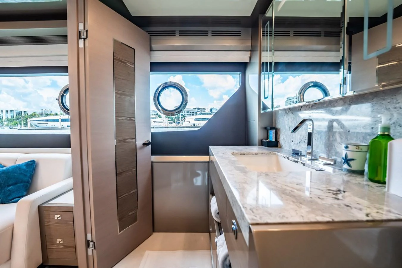 A luxurious yacht bathroom featuring a marble countertop and modern fixtures. aboard AQUASITION Yacht for Sale