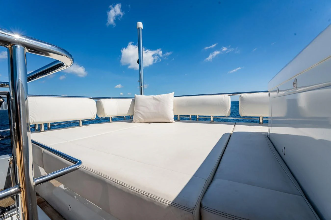 The sundeck offers a luxurious lounging area with plush cushions and stunning ocean views. aboard AQUASITION Yacht for Sale