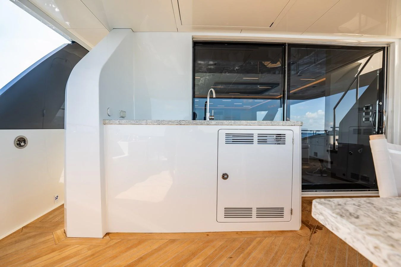 The yacht's galley features modern amenities and a sleek design with a marble countertop and ample storage. aboard AQUASITION Yacht for Sale