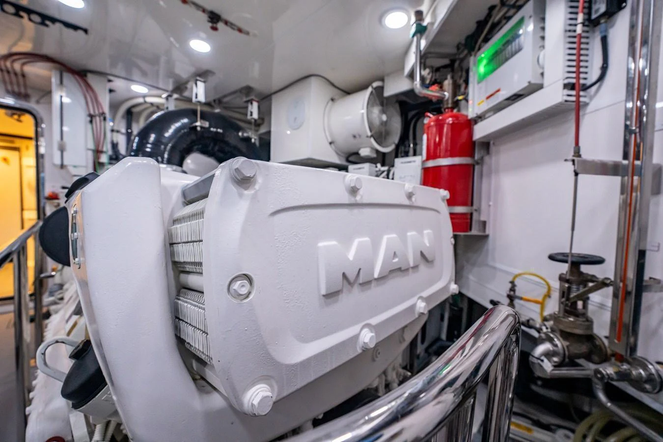 A close-up view of the yacht's engine room showcasing the MAN engine and various technical equipment. aboard AQUASITION Yacht for Sale