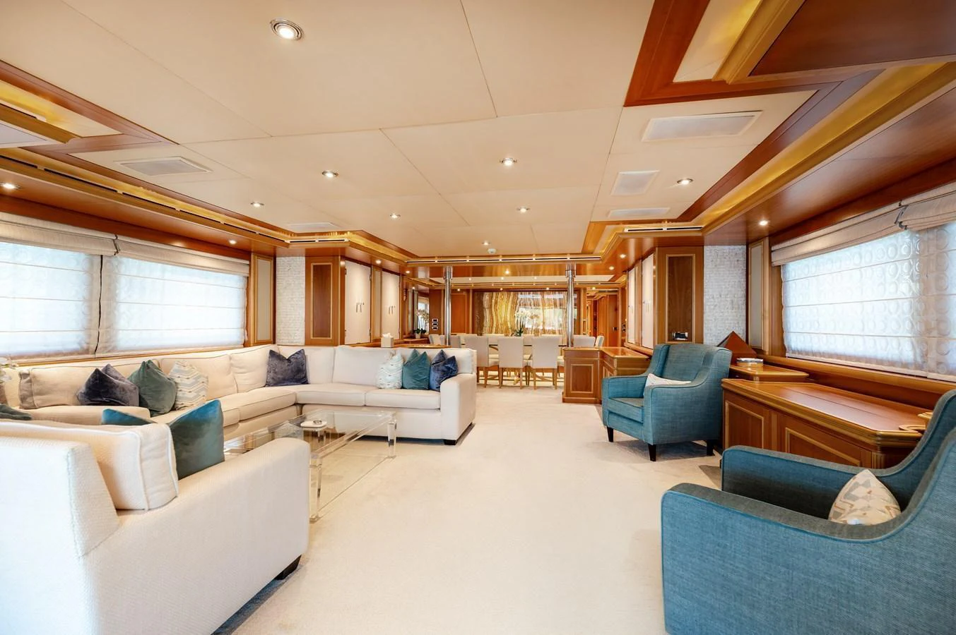 The yacht's salon exudes elegance with plush seating and refined wood accents. aboard EMOTION 2 Yacht for Sale