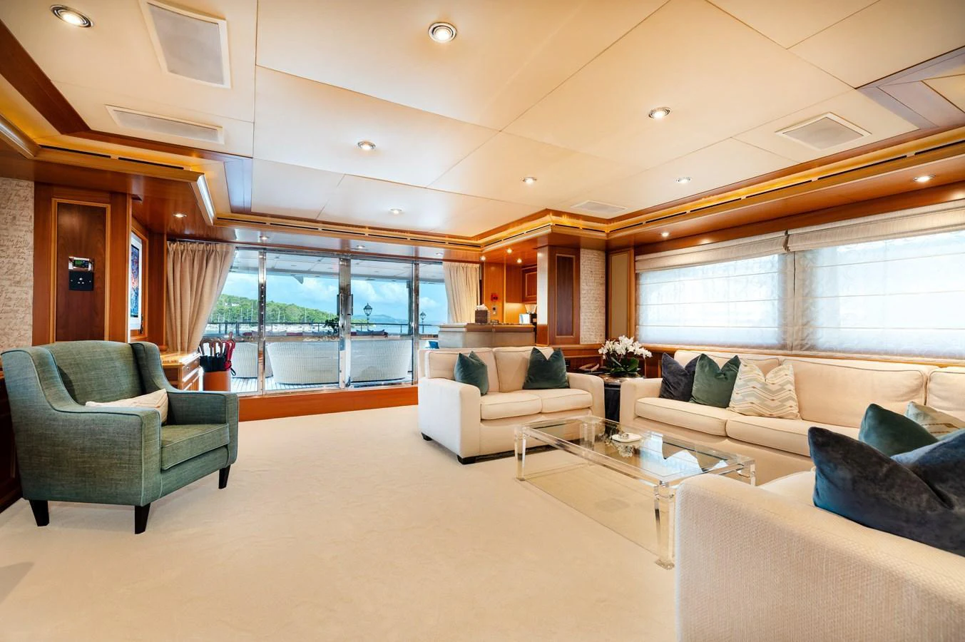 The spacious salon features elegant seating and large windows for panoramic views. aboard EMOTION 2 Yacht for Sale