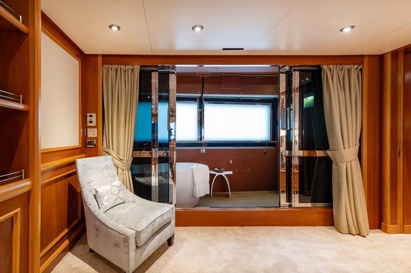 The master stateroom features a luxurious seating area and a spacious bathroom with elegant finishes. aboard EMOTION 2 Yacht for Sale