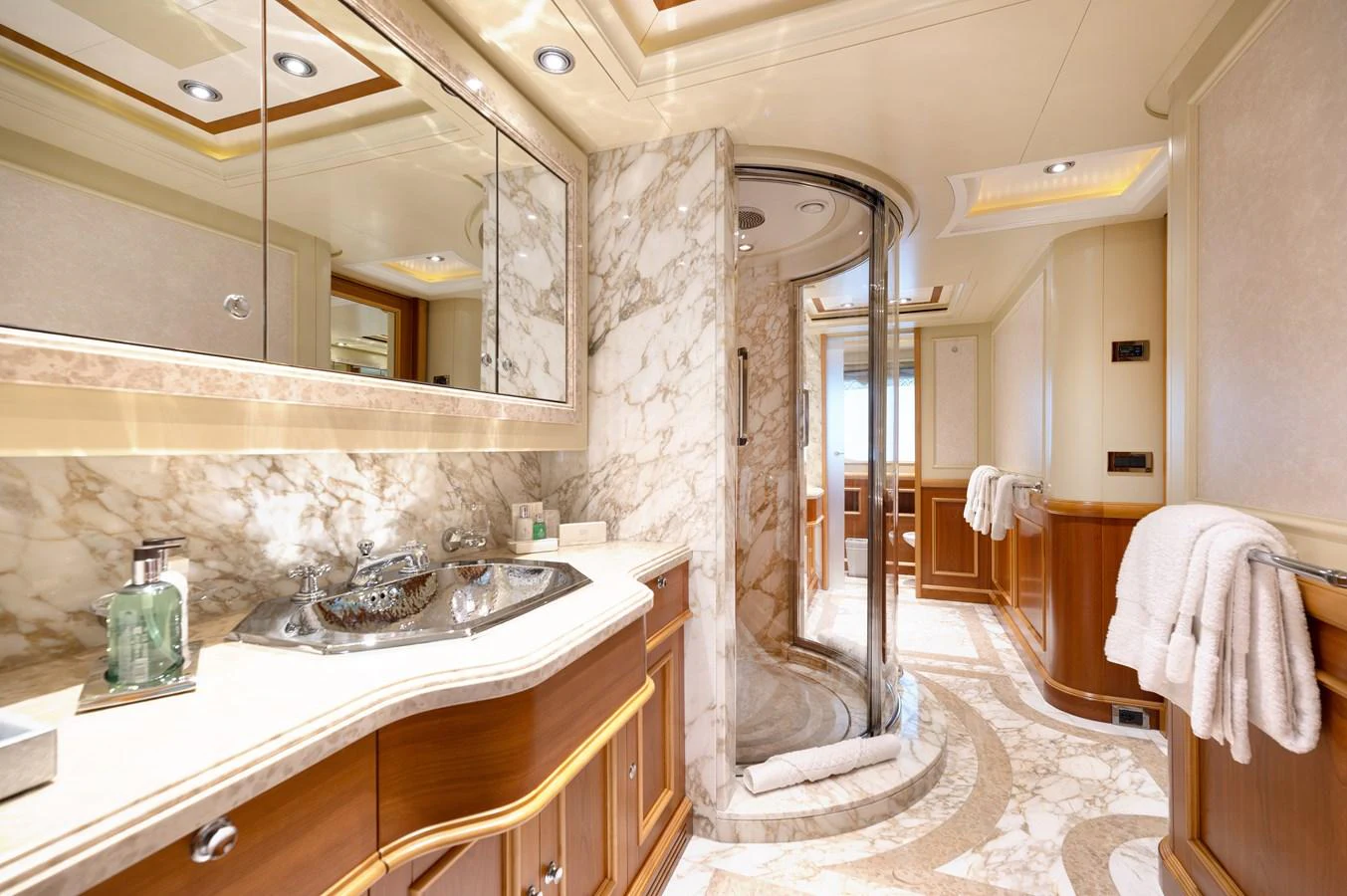 The yacht's bathroom features luxurious marble finishes and elegant wood accents. aboard EMOTION 2 Yacht for Sale