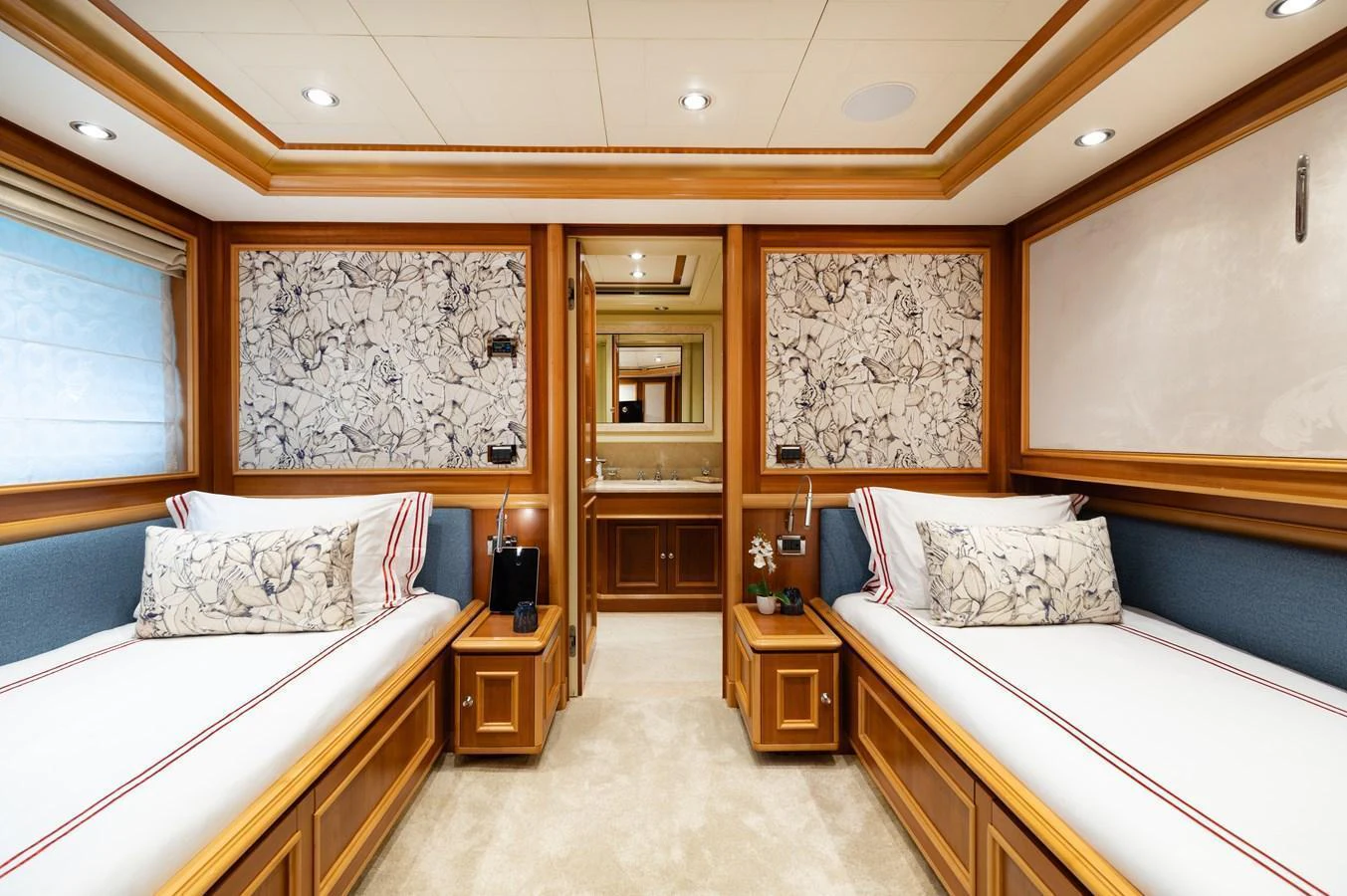 The twin stateroom offers a cozy and elegant retreat with two single beds and luxurious decor. aboard EMOTION 2 Yacht for Sale