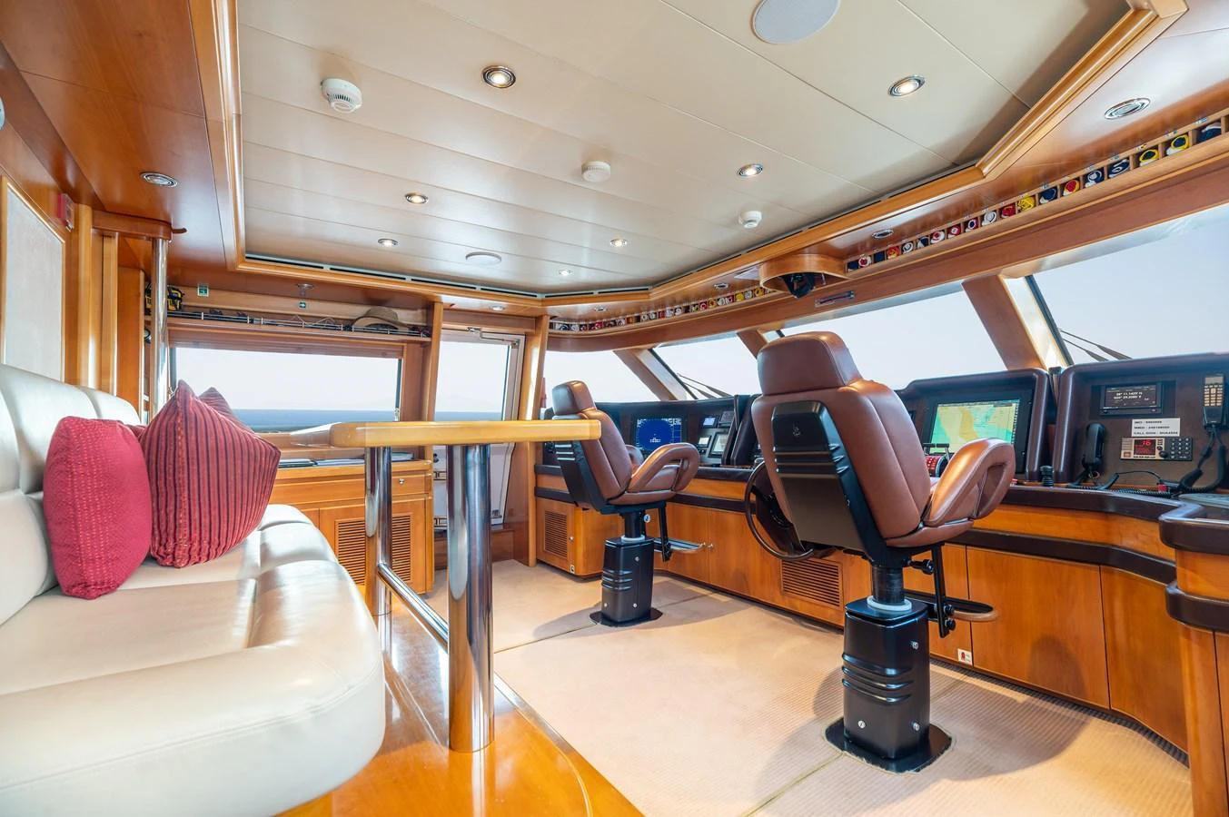 The helm station features luxurious seating and state-of-the-art navigation equipment. aboard EMOTION 2 Yacht for Sale