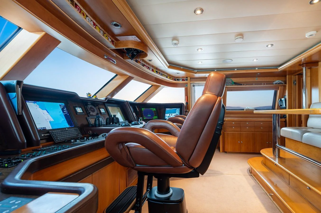 The helm station features state-of-the-art navigation equipment and luxurious seating. aboard EMOTION 2 Yacht for Sale