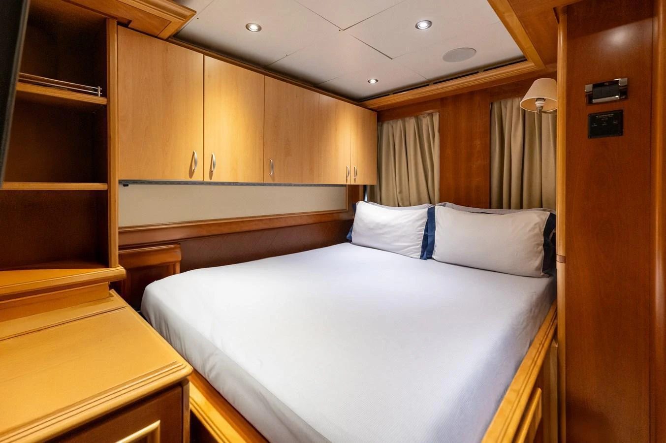 A cozy stateroom with a large bed and ample storage space. aboard EMOTION 2 Yacht for Sale