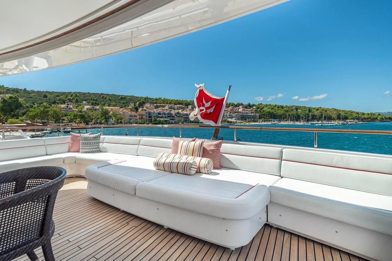 The aft deck offers a spacious and comfortable seating area with stunning views of the coastline. aboard EMOTION 2 Yacht for Sale