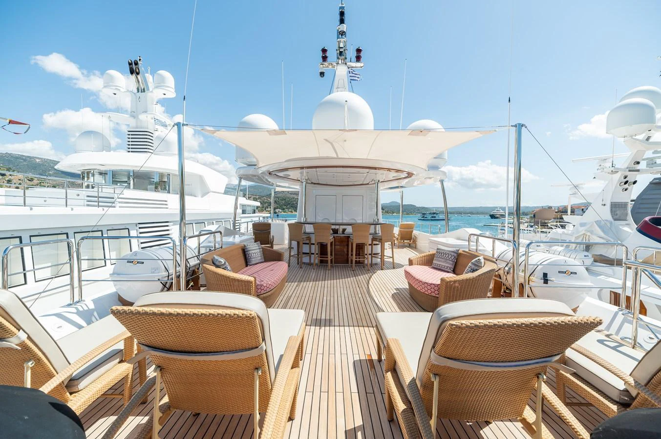 The sundeck offers a luxurious space with ample seating and shade, perfect for relaxation and socializing. aboard EMOTION 2 Yacht for Sale