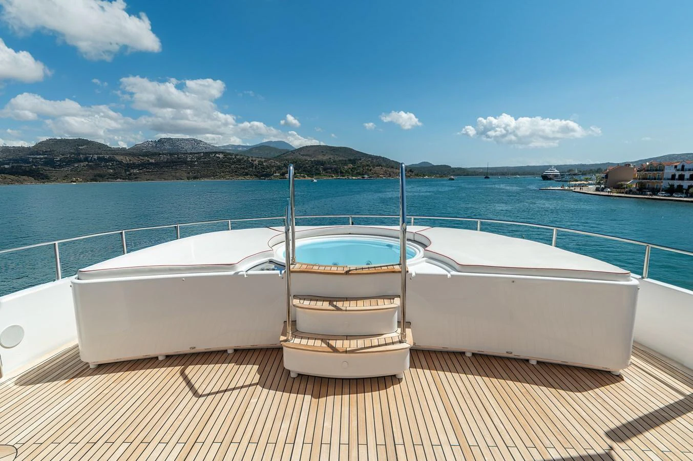 The sundeck features a luxurious hot tub with stunning views of the surrounding waters. aboard EMOTION 2 Yacht for Sale