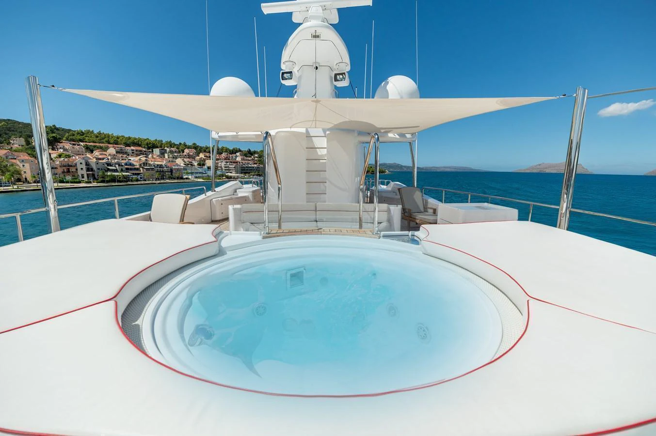 The sundeck features a luxurious jacuzzi with stunning views of the coastline. aboard EMOTION 2 Yacht for Sale