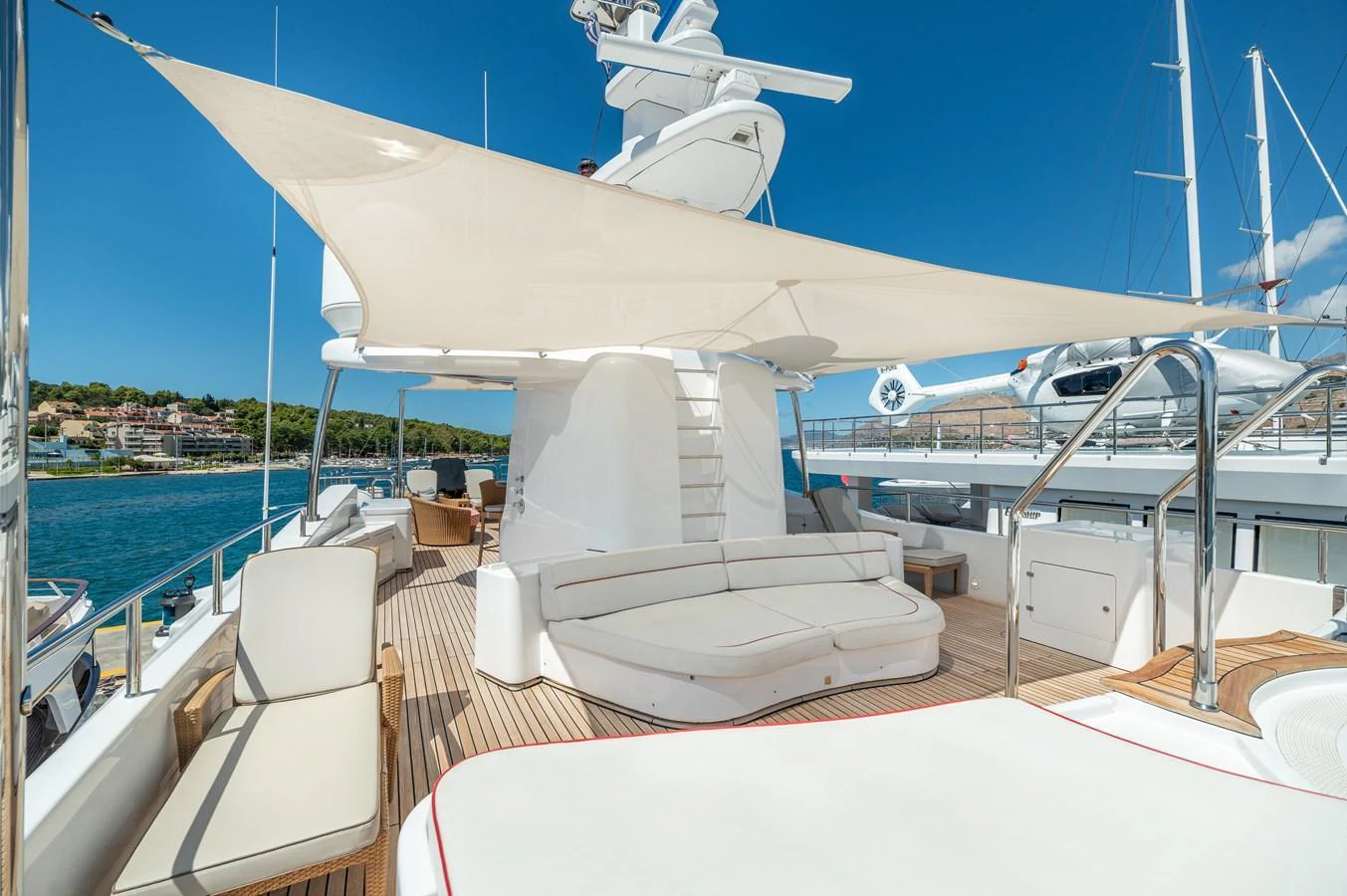 The flybridge offers a spacious and luxurious area for relaxation with ample seating and a sunshade. aboard EMOTION 2 Yacht for Sale