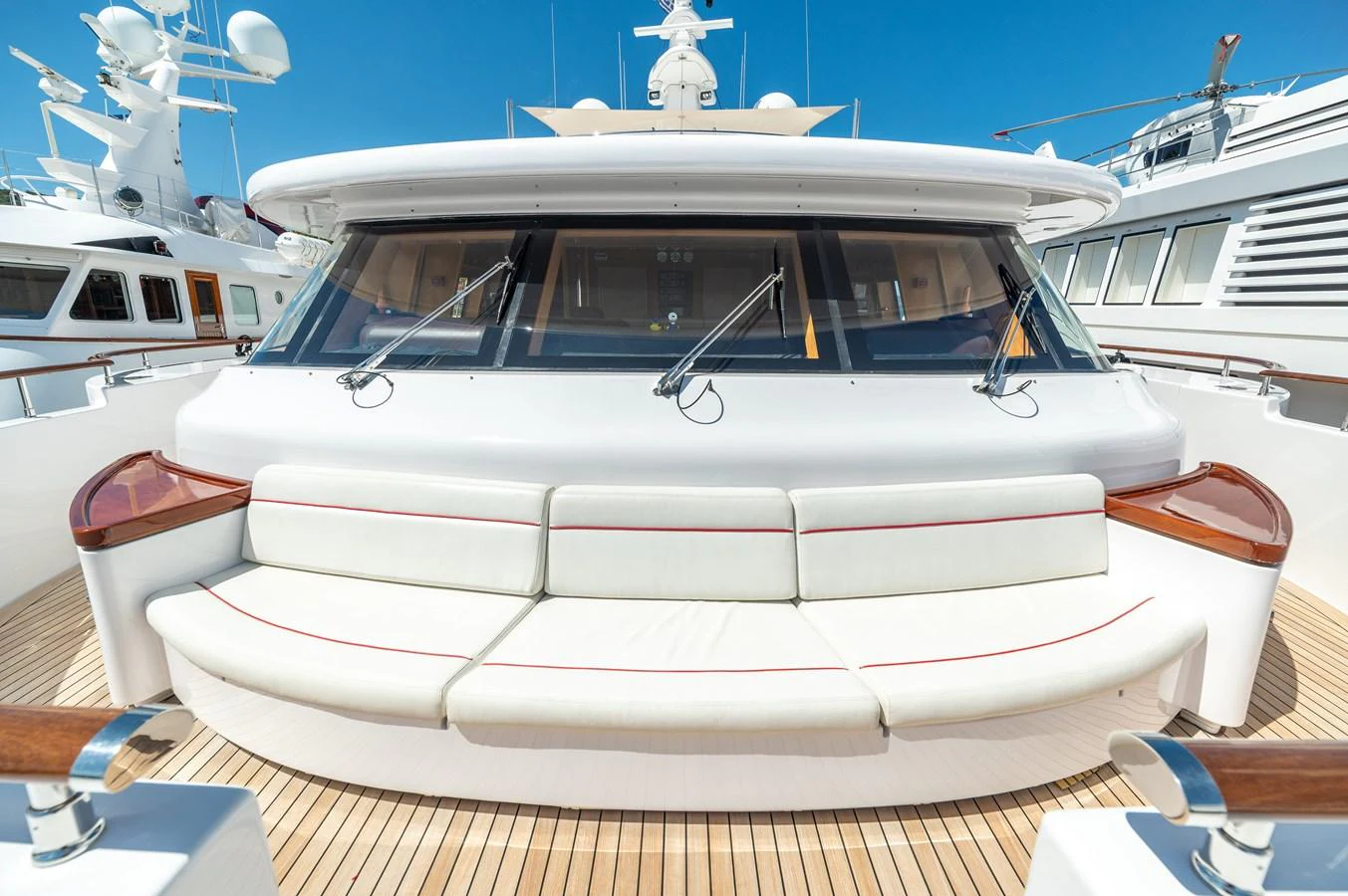 The aft deck features a spacious seating area with a sleek, modern design. aboard EMOTION 2 Yacht for Sale