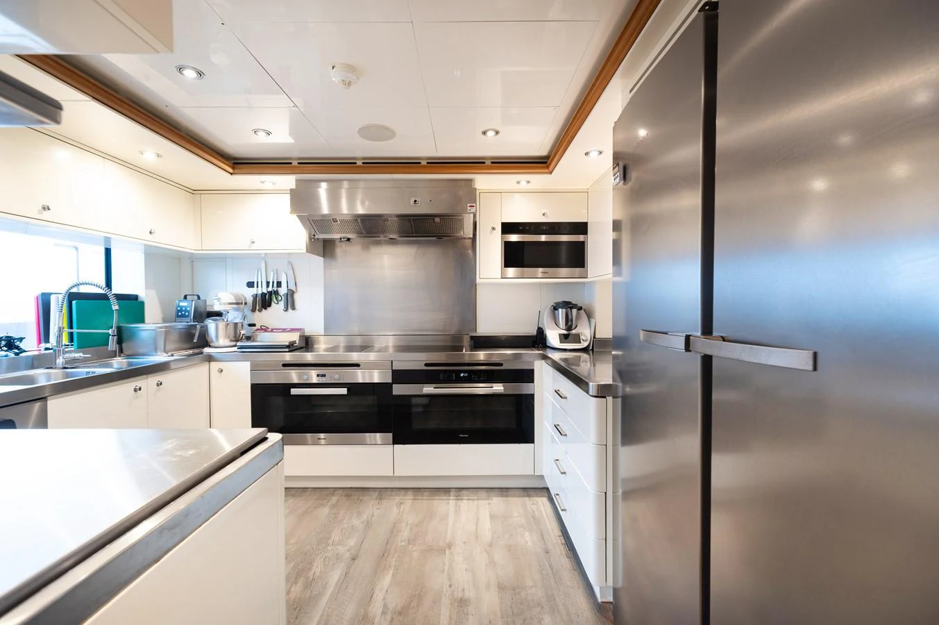 The yacht's galley features modern appliances and a sleek design, perfect for gourmet cooking at sea. aboard EMOTION 2 Yacht for Sale