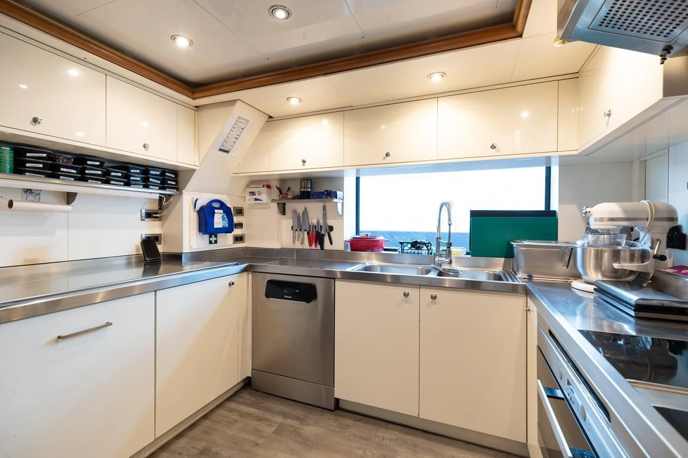 The yacht's galley is equipped with modern appliances and ample counter space, perfect for gourmet meal preparation. aboard EMOTION 2 Yacht for Sale