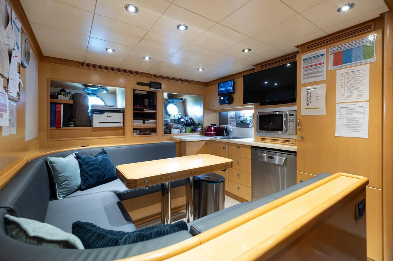 The galley features a cozy dining area with modern appliances and ample storage. aboard EMOTION 2 Yacht for Sale