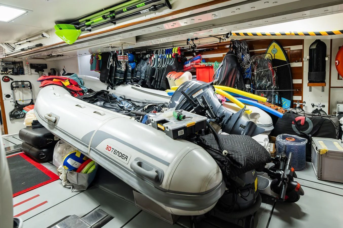 The yacht's tender garage is well-equipped with various watercraft and gear for aquatic adventures. aboard EMOTION 2 Yacht for Sale