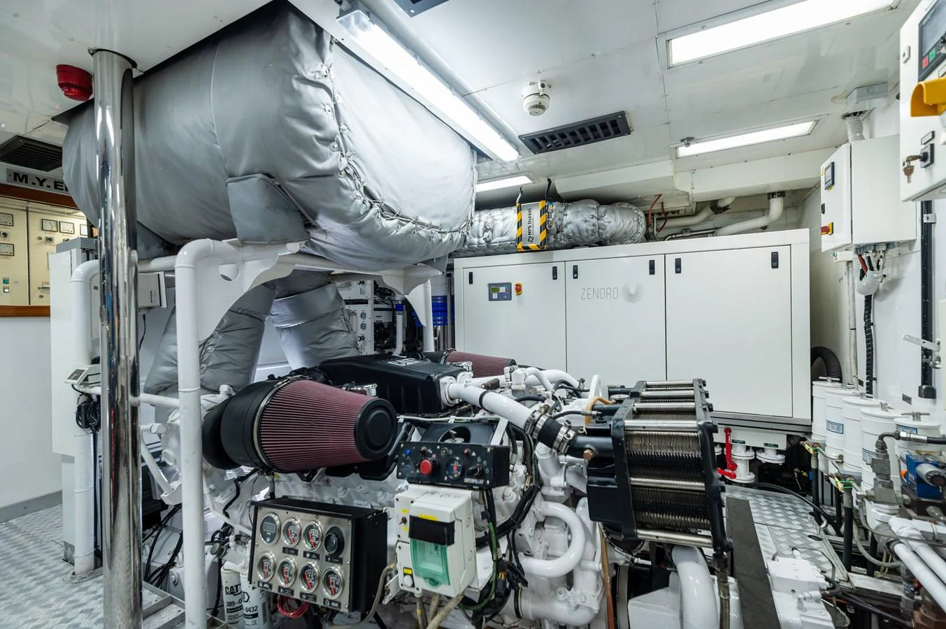 The engine room showcases the yacht's powerful and well-maintained machinery. aboard EMOTION 2 Yacht for Sale