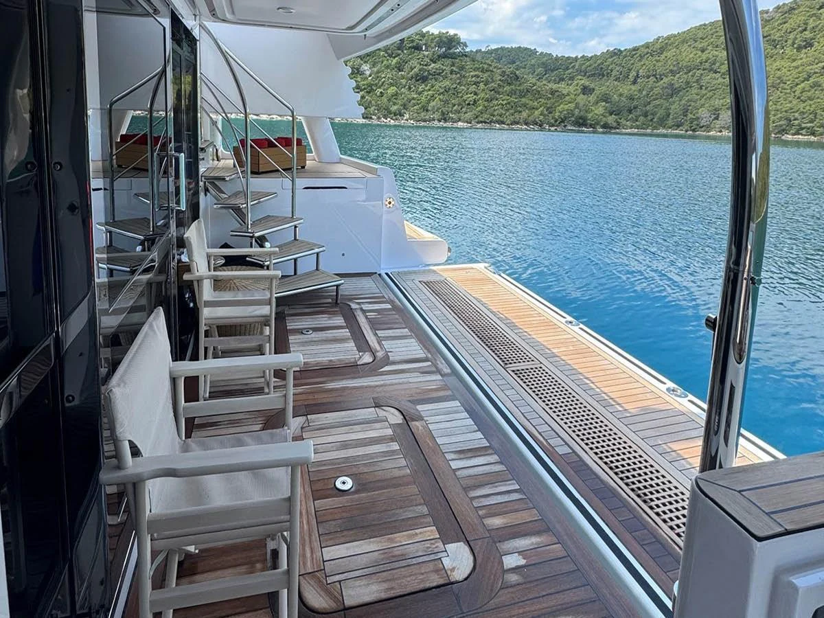 The aft deck offers a serene outdoor space with comfortable seating and stunning views of the surrounding waters. aboard EMOTION 2 Yacht for Sale