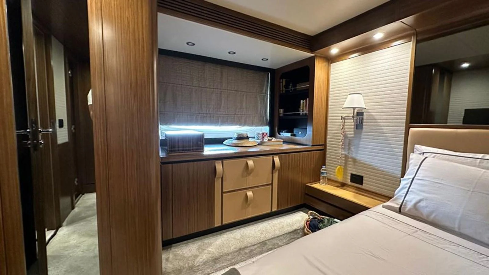 The stateroom features a cozy and elegant design with ample storage and natural light. aboard NINE NINE WINE Yacht for Sale