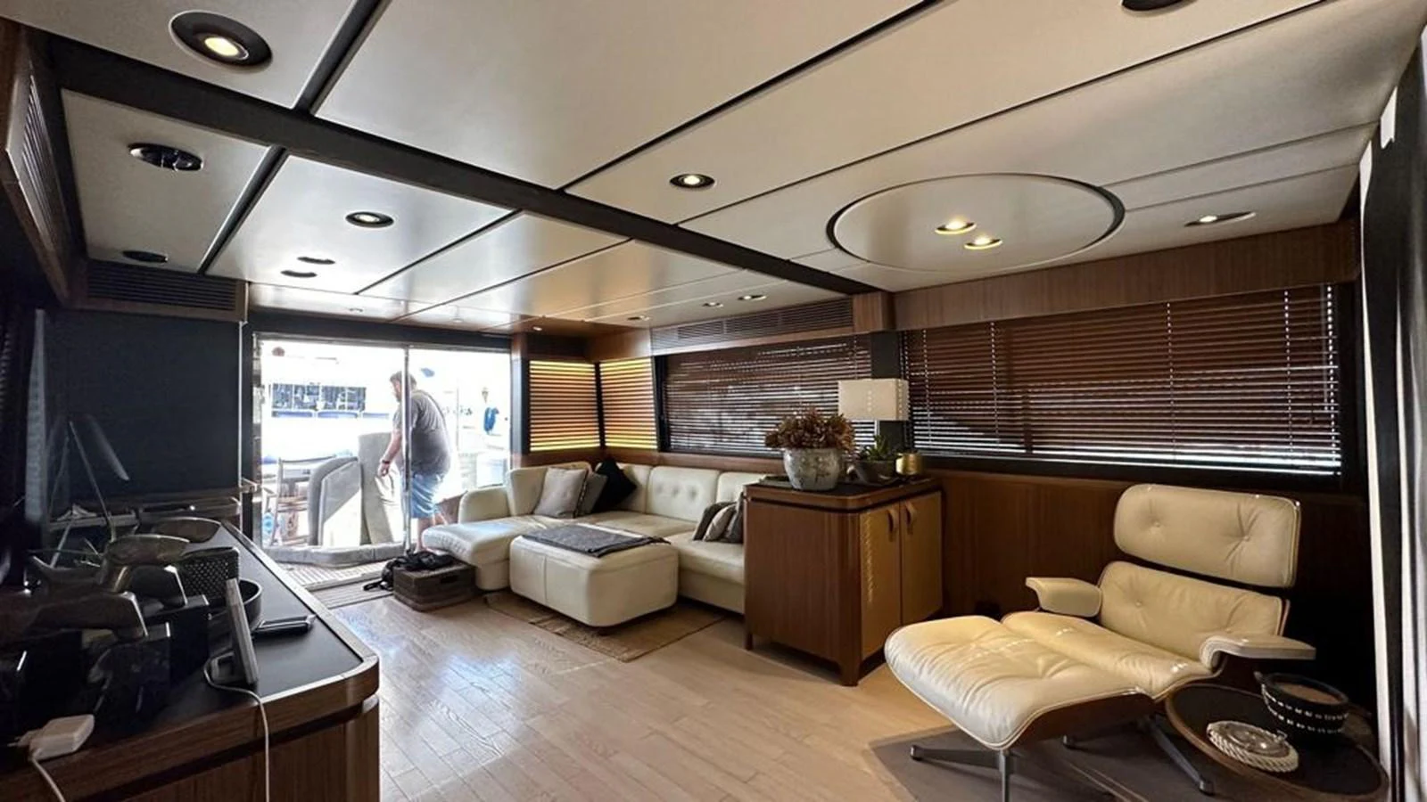 The yacht's salon features a comfortable seating area with modern furnishings and ample natural light. aboard NINE NINE WINE Yacht for Sale