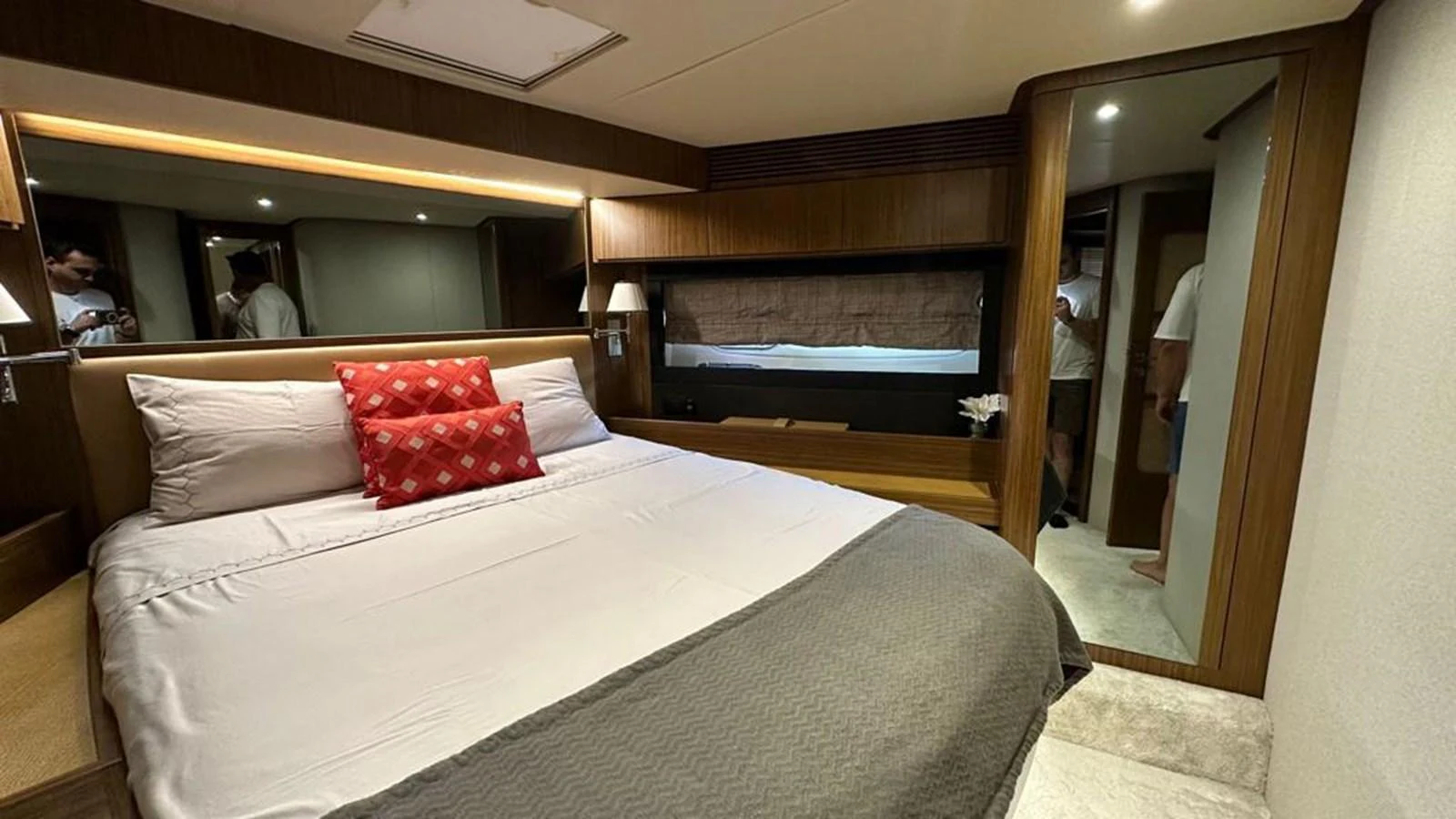 The stateroom features a comfortable bed with elegant bedding and stylish decor. aboard NINE NINE WINE Yacht for Sale
