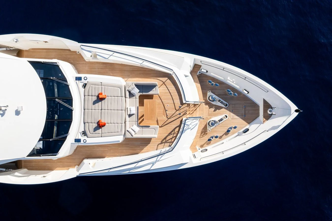 The foredeck features a spacious sunbathing area with plush cushions and a sleek, modern design. aboard ALADDIN Yacht for Sale