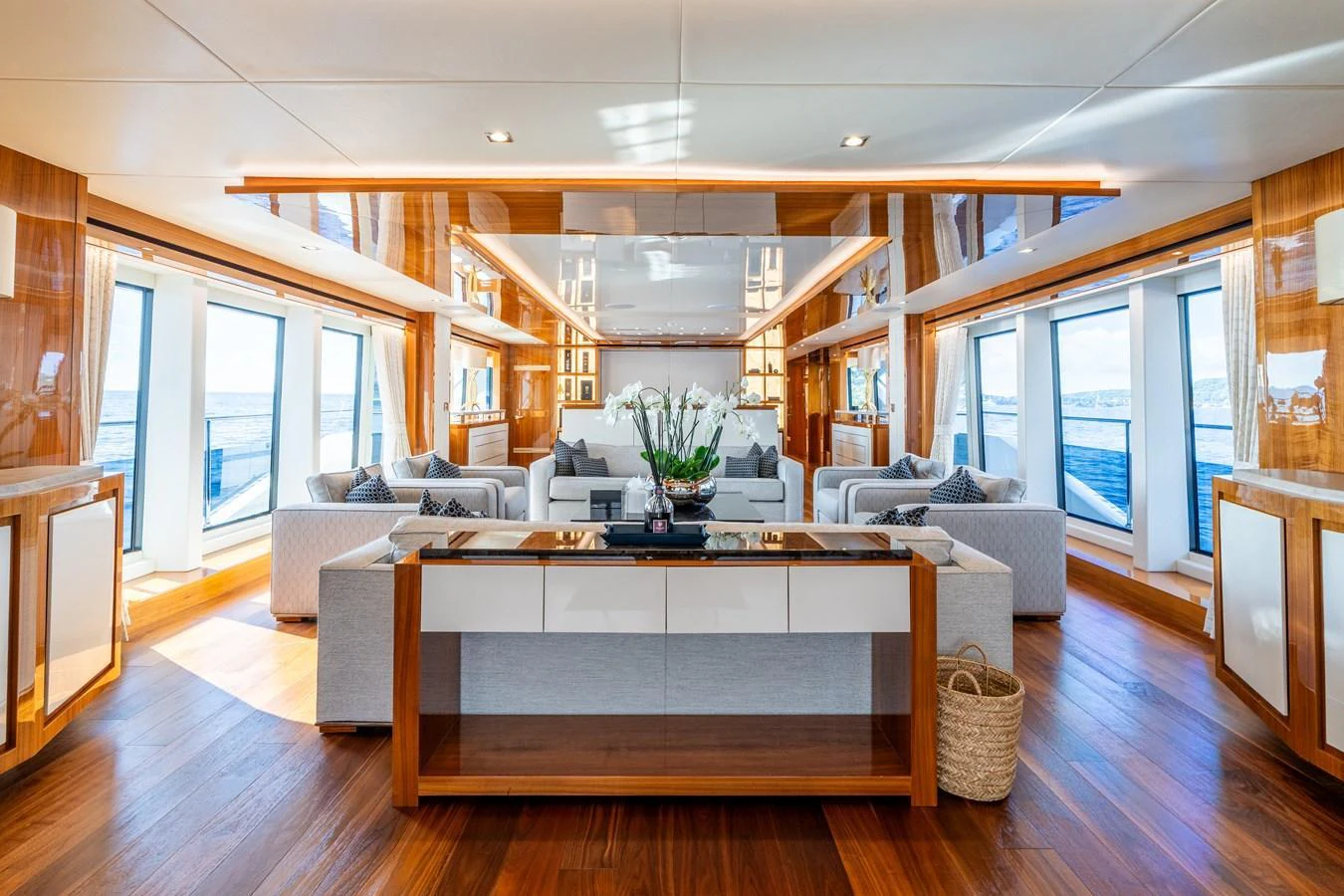 The spacious salon features elegant furnishings and panoramic windows, creating a luxurious and inviting atmosphere. aboard ALADDIN Yacht for Sale