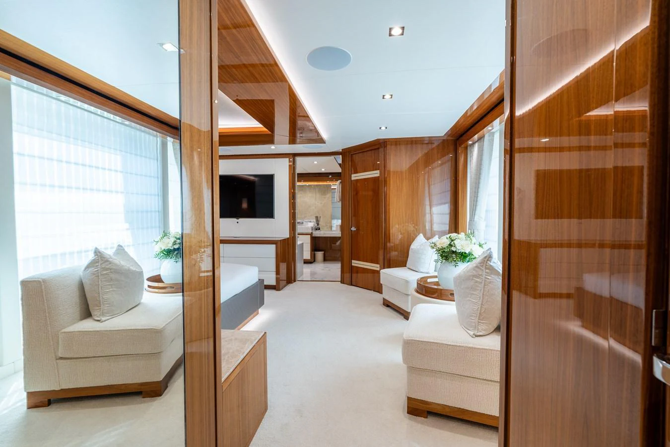 The salon features plush seating, elegant wood finishes, and ample natural light. aboard ALADDIN Yacht for Sale