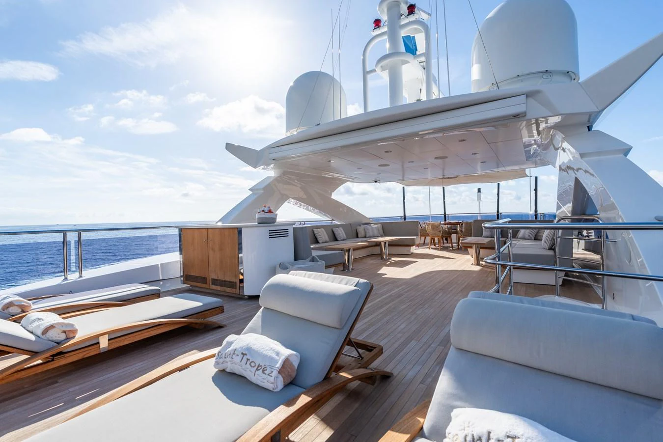 The sundeck offers luxurious lounging with ample seating and stunning ocean views. aboard ALADDIN Yacht for Sale
