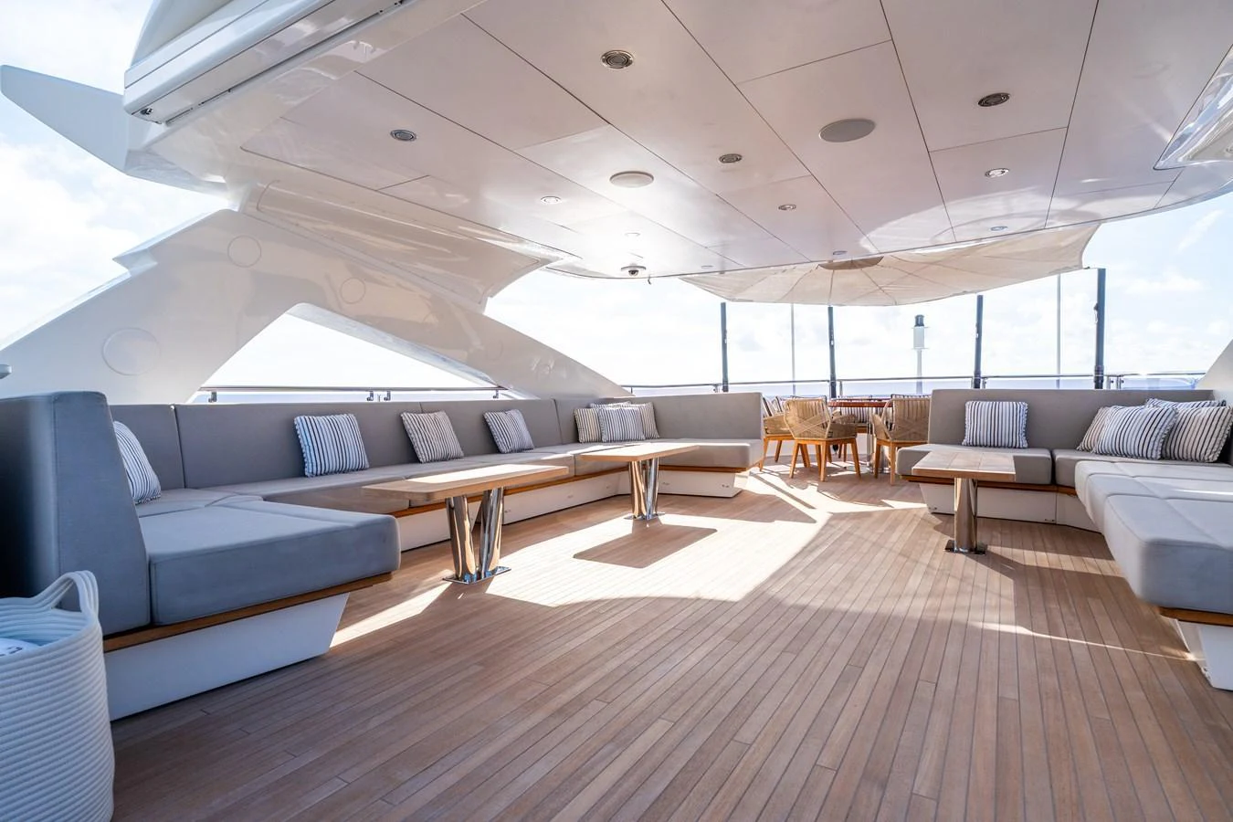 The sundeck offers a spacious and elegant seating area with ample natural light and modern furnishings. aboard ALADDIN Yacht for Sale