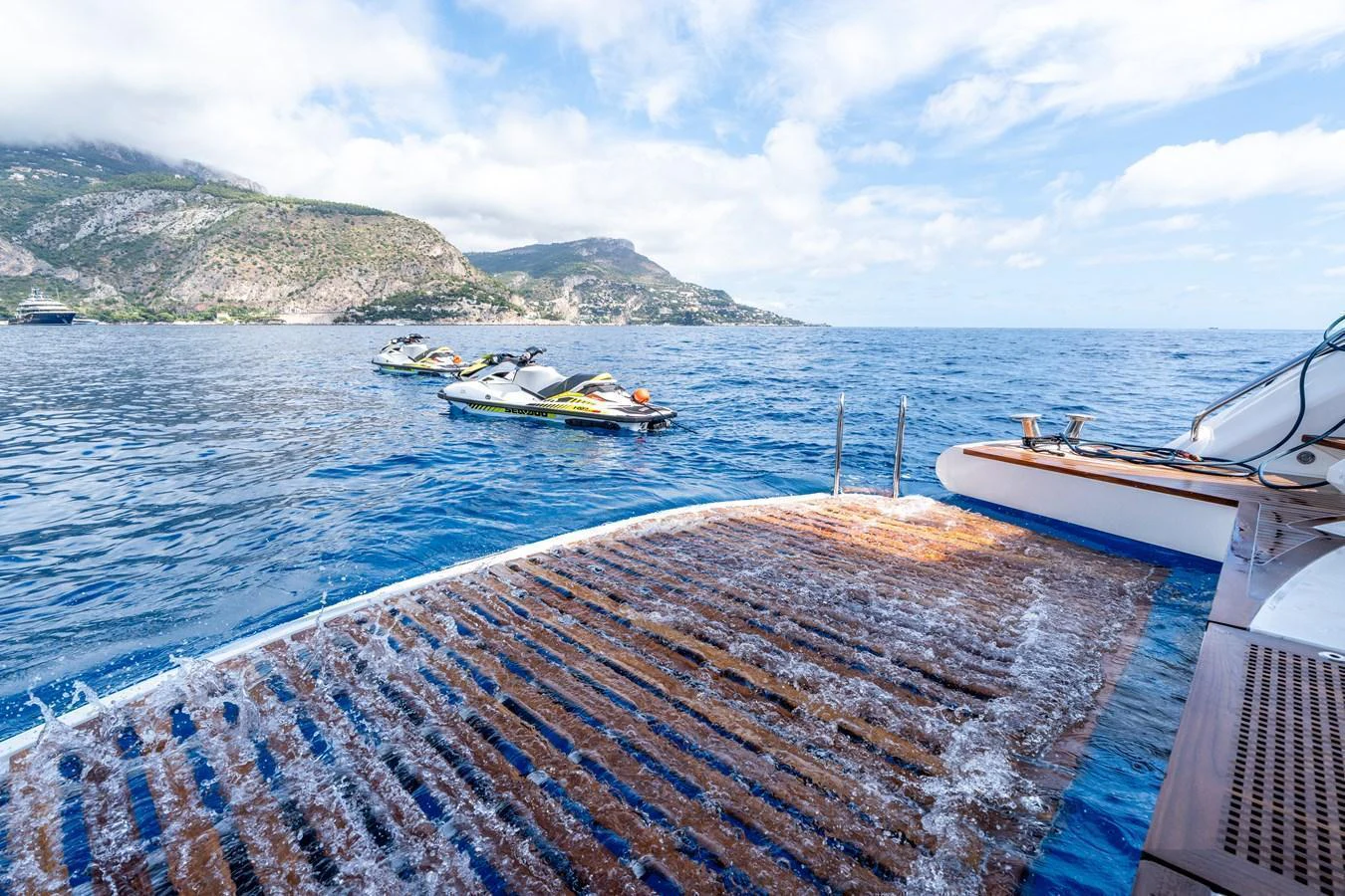 The yacht's swim platform offers easy access to the water, perfect for enjoying water sports. aboard ALADDIN Yacht for Sale