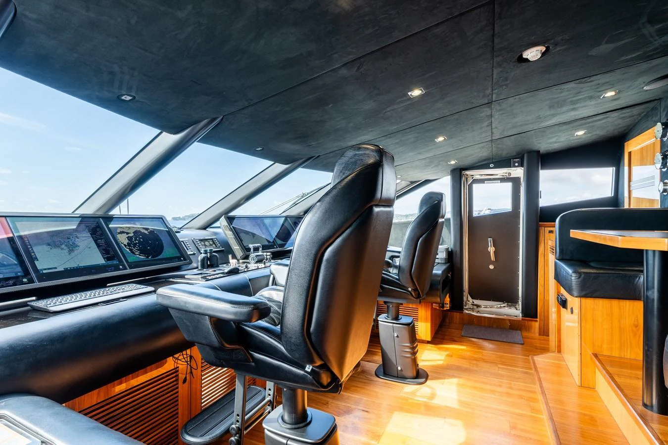 The helm station features advanced navigation equipment and luxurious seating. aboard ALADDIN Yacht for Sale