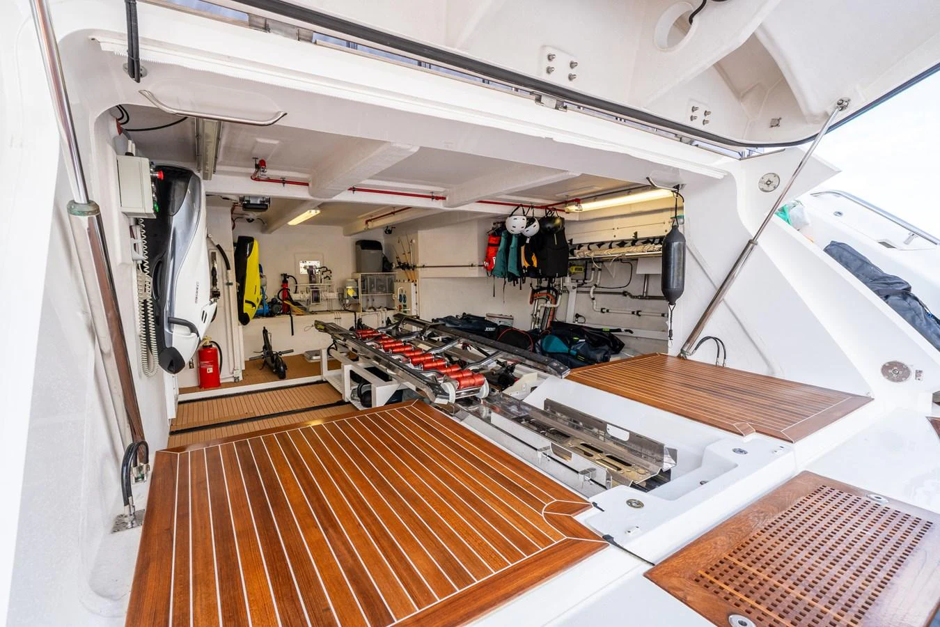 The image showcases a well-organized storage area with various equipment and accessories neatly arranged. aboard ALADDIN Yacht for Sale