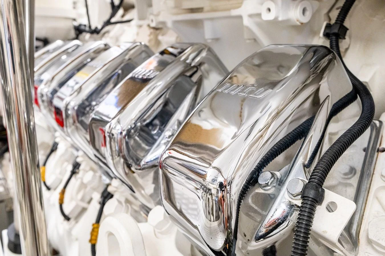 A close-up view of the yacht's polished engine components, showcasing meticulous engineering. aboard ALADDIN Yacht for Sale