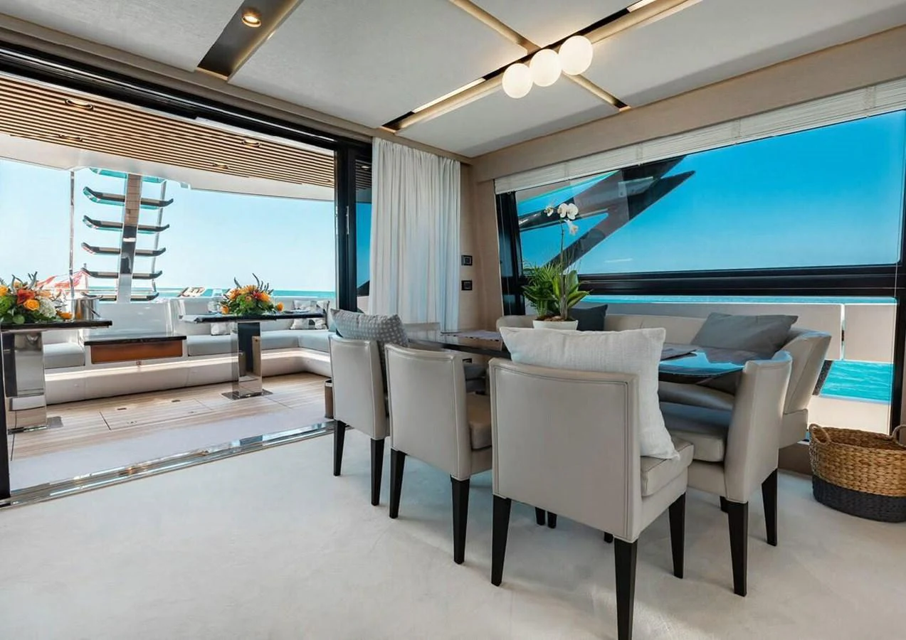 The yacht's dining area offers a luxurious and open space with a seamless transition to the outdoor deck. aboard LANCE WEST Yacht for Sale
