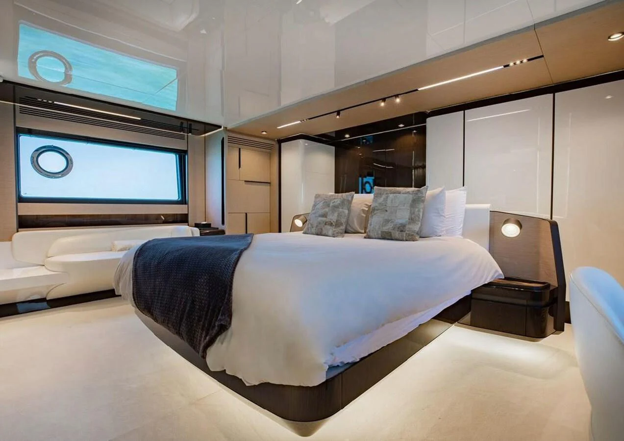 The master stateroom features a luxurious bed with modern decor and ample natural light. aboard LANCE WEST Yacht for Sale