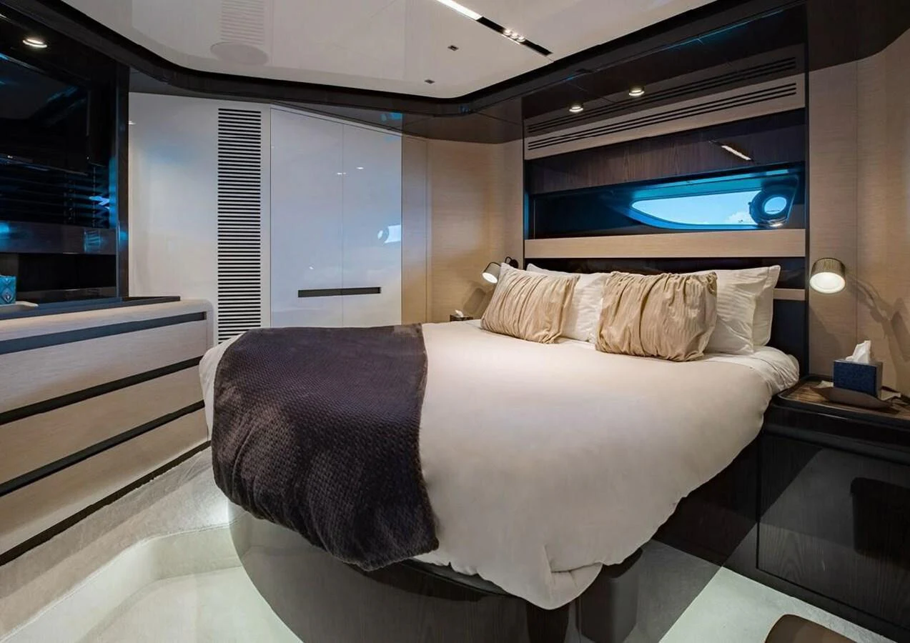 A luxurious stateroom featuring a plush bed with elegant bedding and modern design elements. aboard LANCE WEST Yacht for Sale