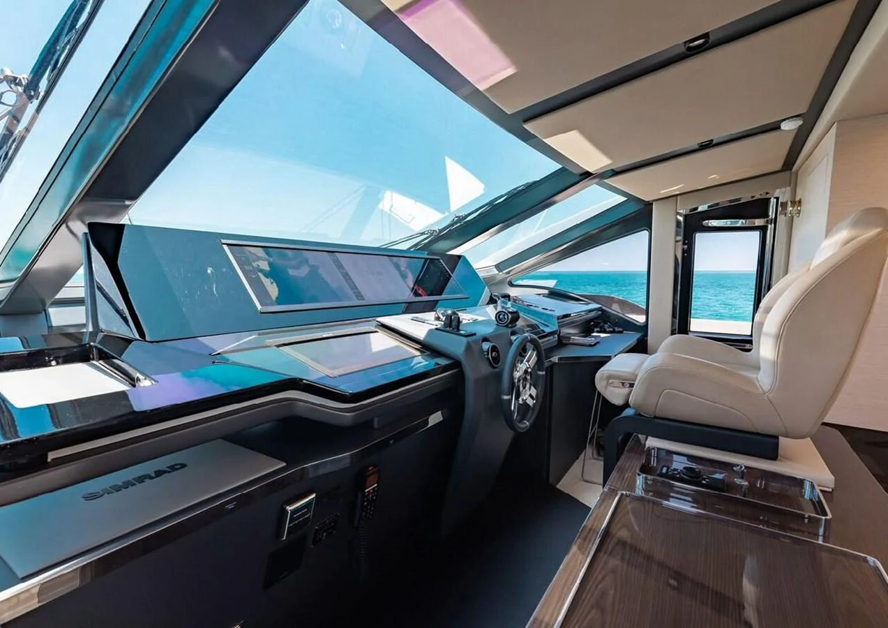 The helm station offers a sleek and modern design with advanced navigation equipment and panoramic views. aboard LANCE WEST Yacht for Sale