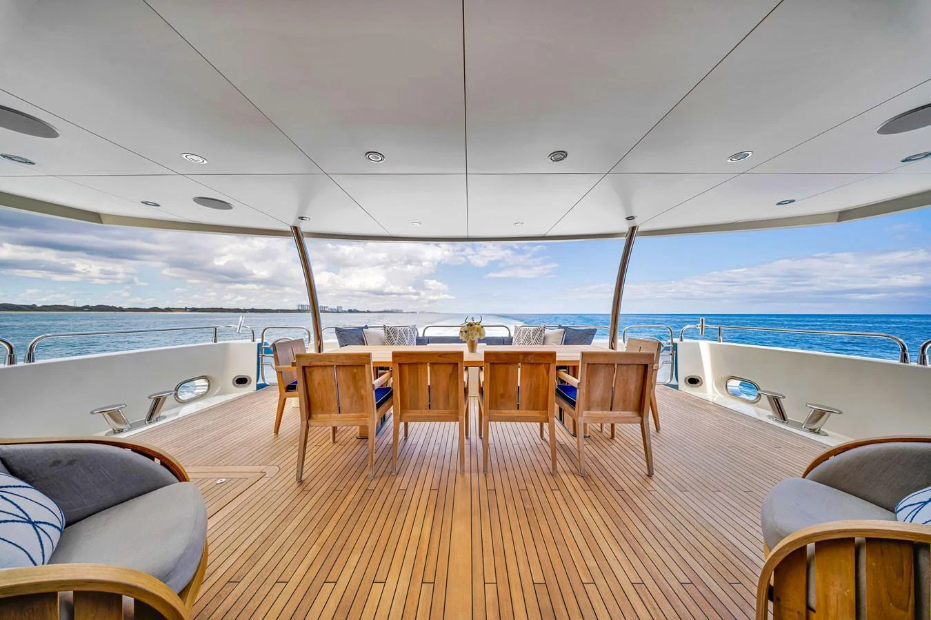 The aft deck offers a spacious and inviting area for alfresco dining with stunning ocean views. aboard NATURAL 9 Yacht for Sale