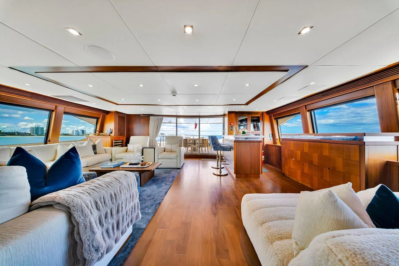 The spacious salon features elegant furnishings and panoramic windows, creating a luxurious and inviting atmosphere. aboard NATURAL 9 Yacht for Sale