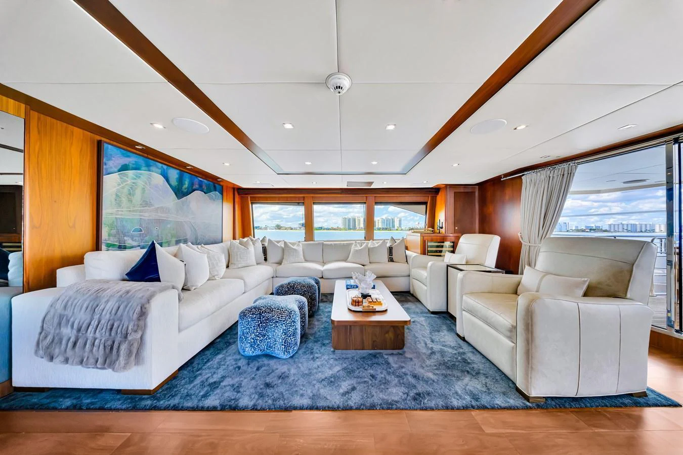 The spacious salon features luxurious seating with panoramic views. aboard NATURAL 9 Yacht for Sale
