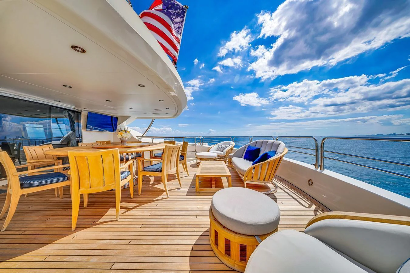 The spacious aft deck offers luxurious outdoor dining and relaxation with stunning ocean views. aboard NATURAL 9 Yacht for Sale