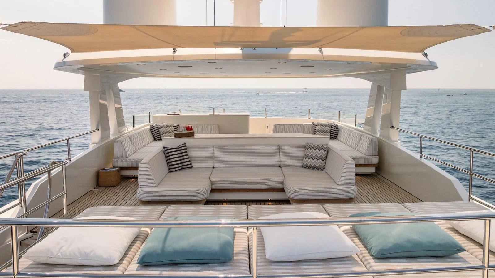 The sundeck offers a spacious lounging area with plush seating and scenic ocean views. aboard KOKORO Yacht for Sale