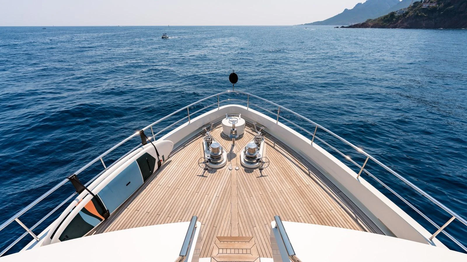 The yacht's bow offers a stunning view of the open sea and distant coastline. aboard KOKORO Yacht for Sale